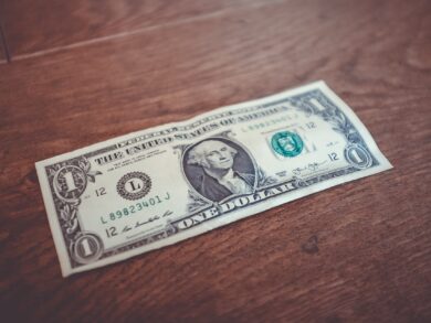 Dollar bill on table